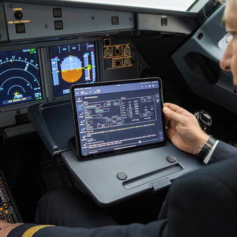 A pilot using the Navigation+ solution in the cockpit  