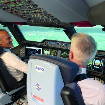 Two pilots in a flight simulator