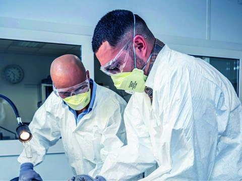 Two technicians engaging in structure aircraft training by working on a part of an aircraft frame