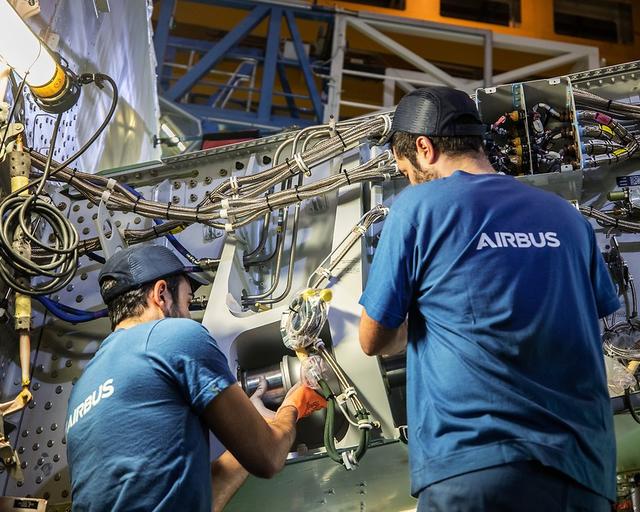 Type training Maintenance personnel working on an aircraft component, ensuring operational safety and efficiency.