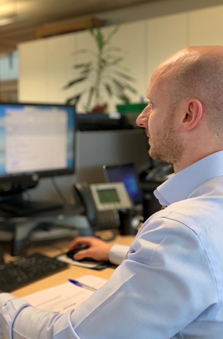 Person working in front of screens