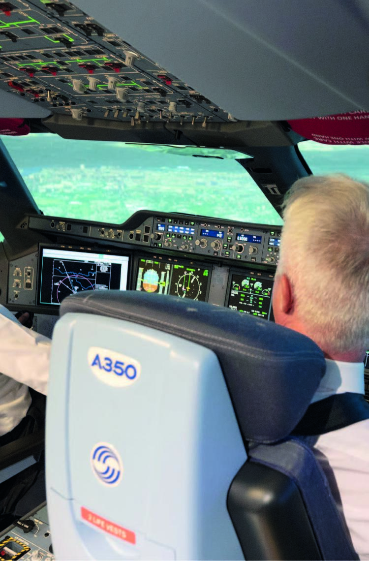 Two pilots in a flight simulator Two pilots in a flight simulator